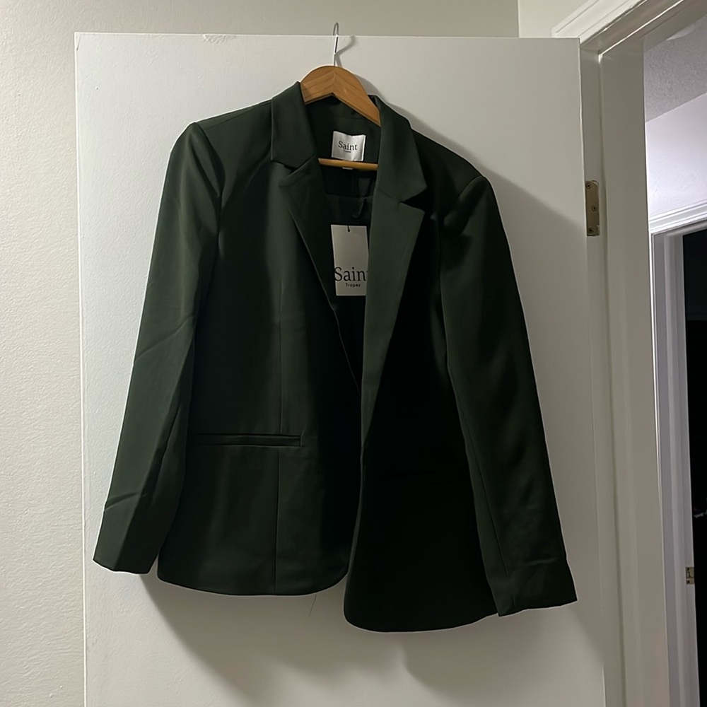 Green. Never worn, excellent condition.